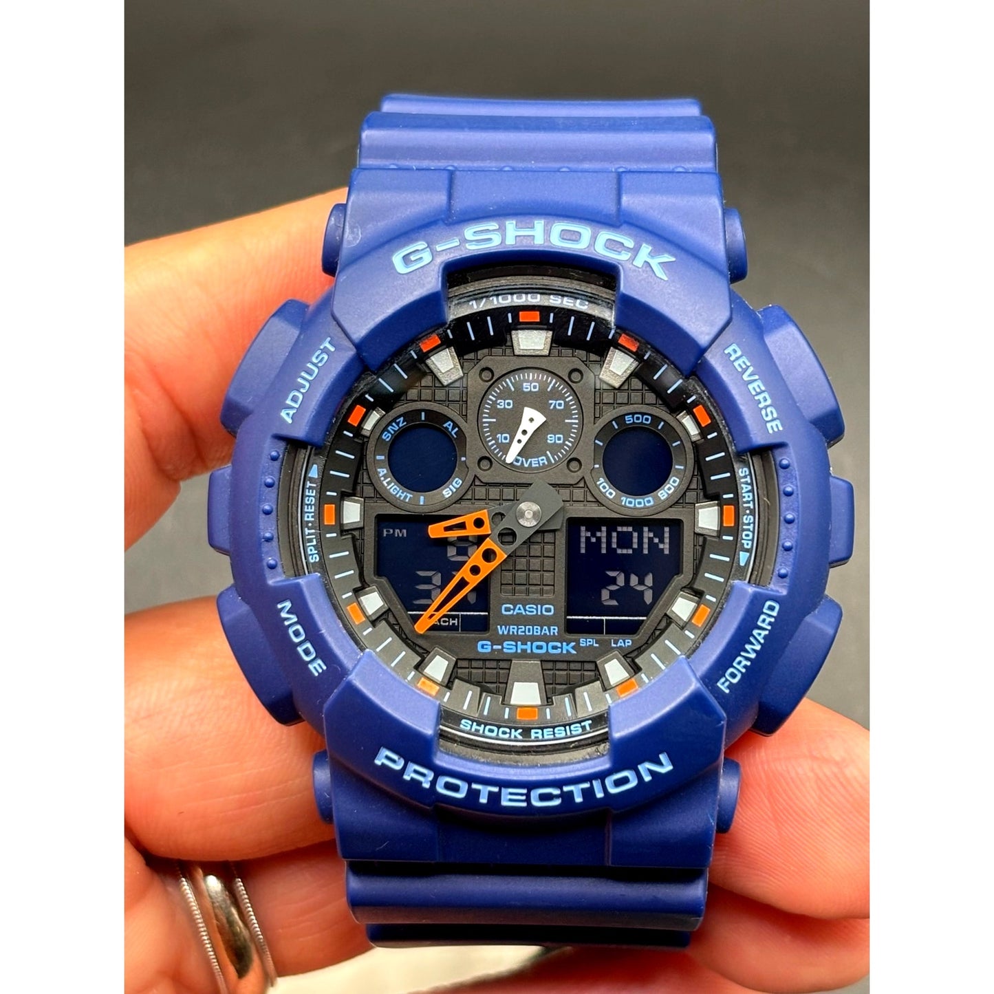 Casio G-Shock GA100L-2A Military Blue Orange Band Men's Analog-Digital Watch