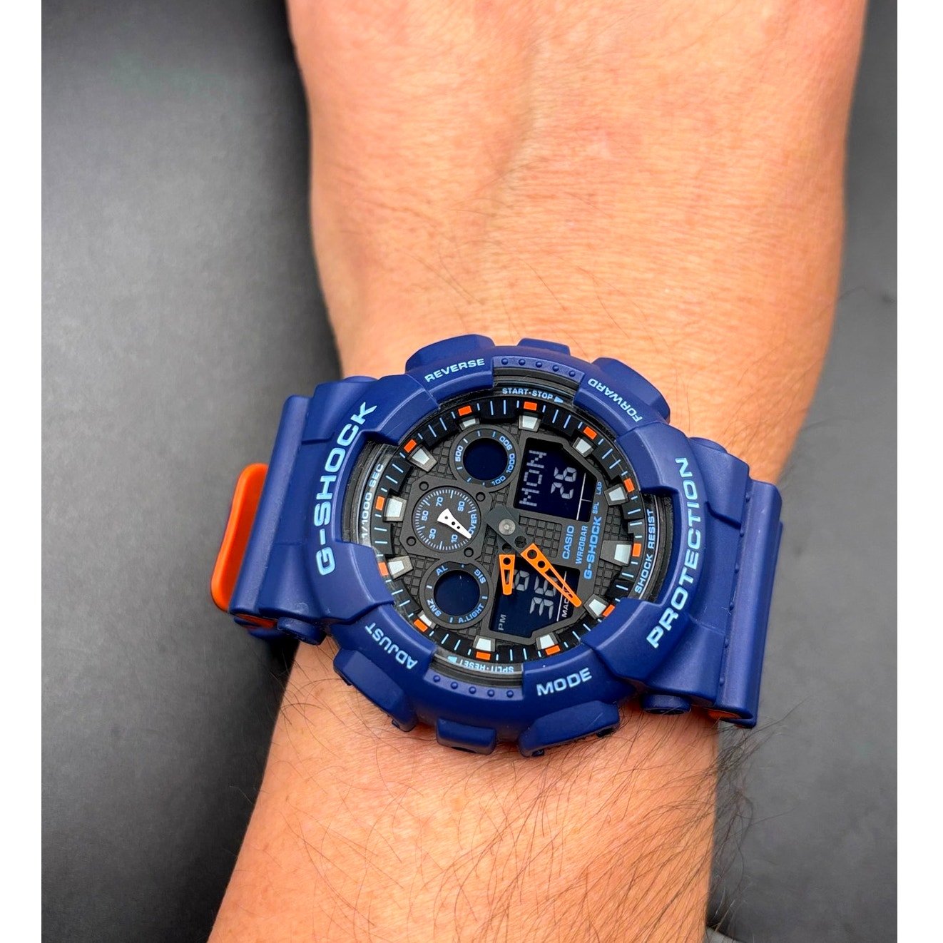 Casio G-Shock GA100L-2A Military Blue Orange Band Men's Analog-Digital Watch