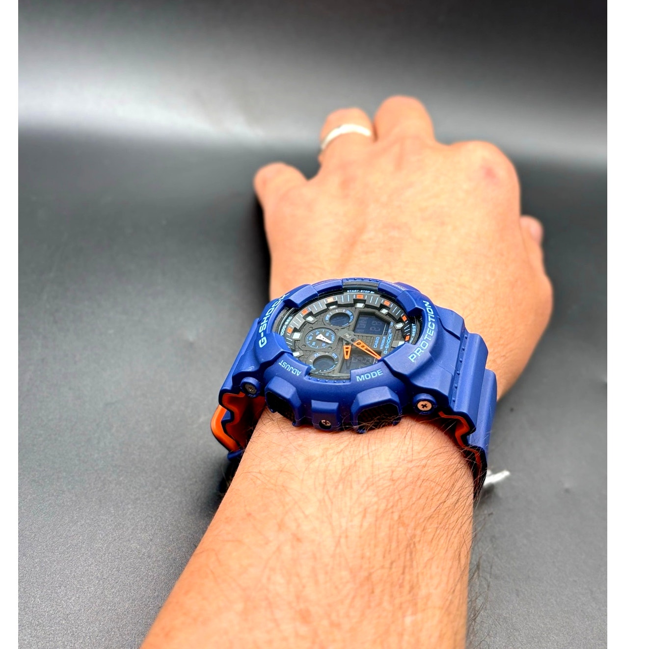 Casio G-Shock GA100L-2A Military Blue Orange Band Men's Analog-Digital Watch