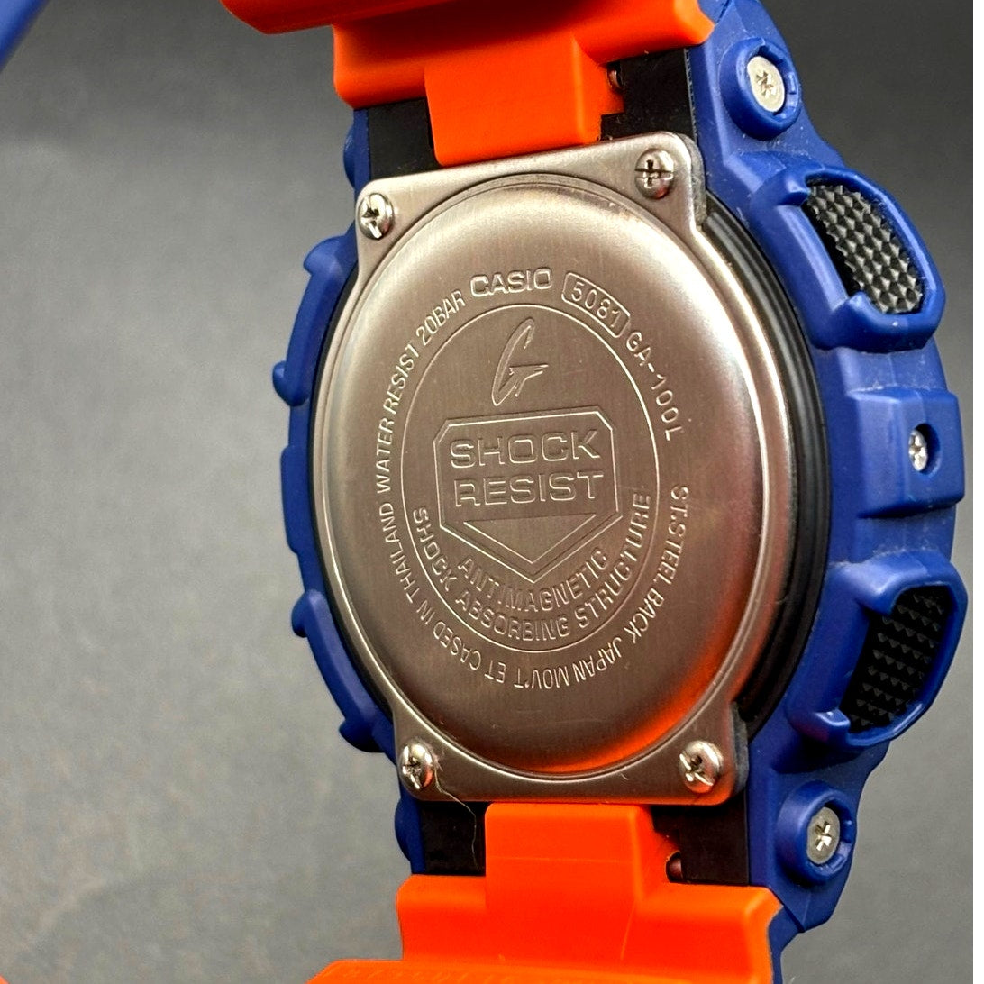 Casio G-Shock GA100L-2A Military Blue Orange Band Men's Analog-Digital Watch