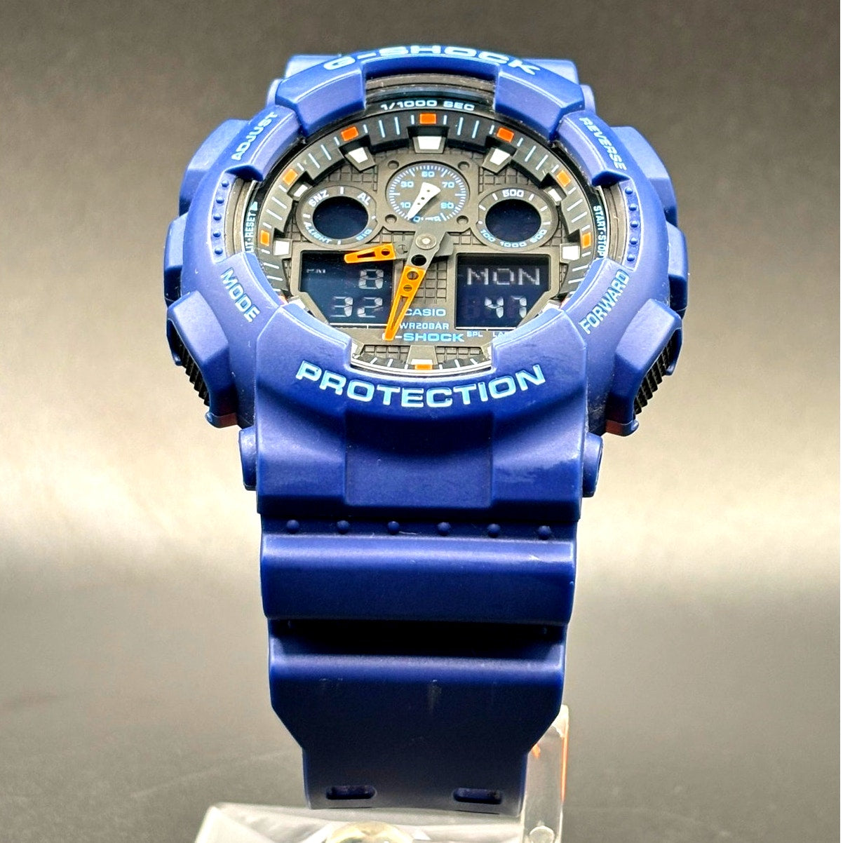 Casio G-Shock GA100L-2A Military Blue Orange Band Men's Analog-Digital Watch