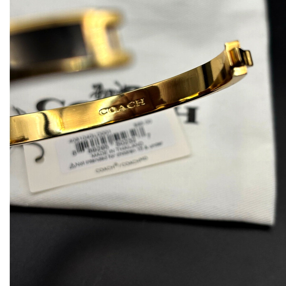 Coach 408104GLD001 Thin Enamel Signature Push Hinged Bangle Gold/Black NWT