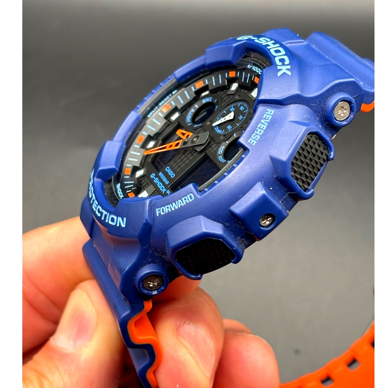 Casio G-Shock GA100L-2A Military Blue Orange Band Men's Analog-Digital Watch