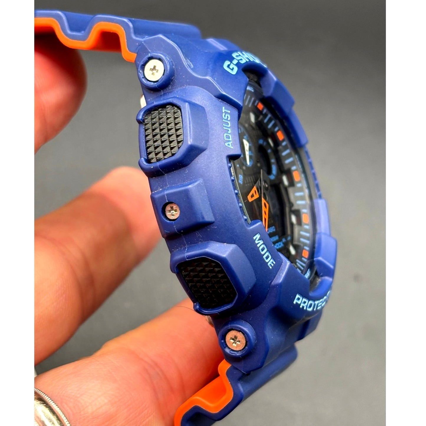 Casio G-Shock GA100L-2A Military Blue Orange Band Men's Analog-Digital Watch